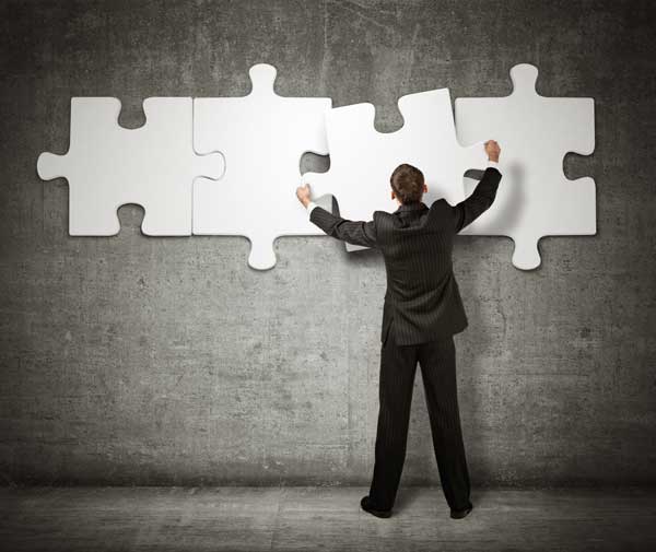 Business Man making a puzzle on the wall Fort Lauderdale Chapter 13 Bankruptcy Attorney